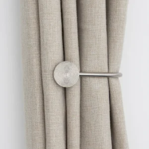 | Feature | Details | | ------------- | -------------------------------------- | | Product Type | Curtain Holdbacks | | Design | Ribbed Metal Style | | Material | High-Quality Metal | | Finish | Durable & Decorative Finish | | Usage | Holding Curtains Securely in Place | | Installation | Easy Wall Mount Installation | | Durability | Strong & Long-Lasting Construction | | Style | Modern & Elegant Appearance | | Compatibility | Suitable for Most Curtain Types | | Ideal For | Living Rooms, Bedrooms & Offices | | Maintenance | Easy to Clean & Maintain | | Functionality | Decorative & Practical Curtain Support |